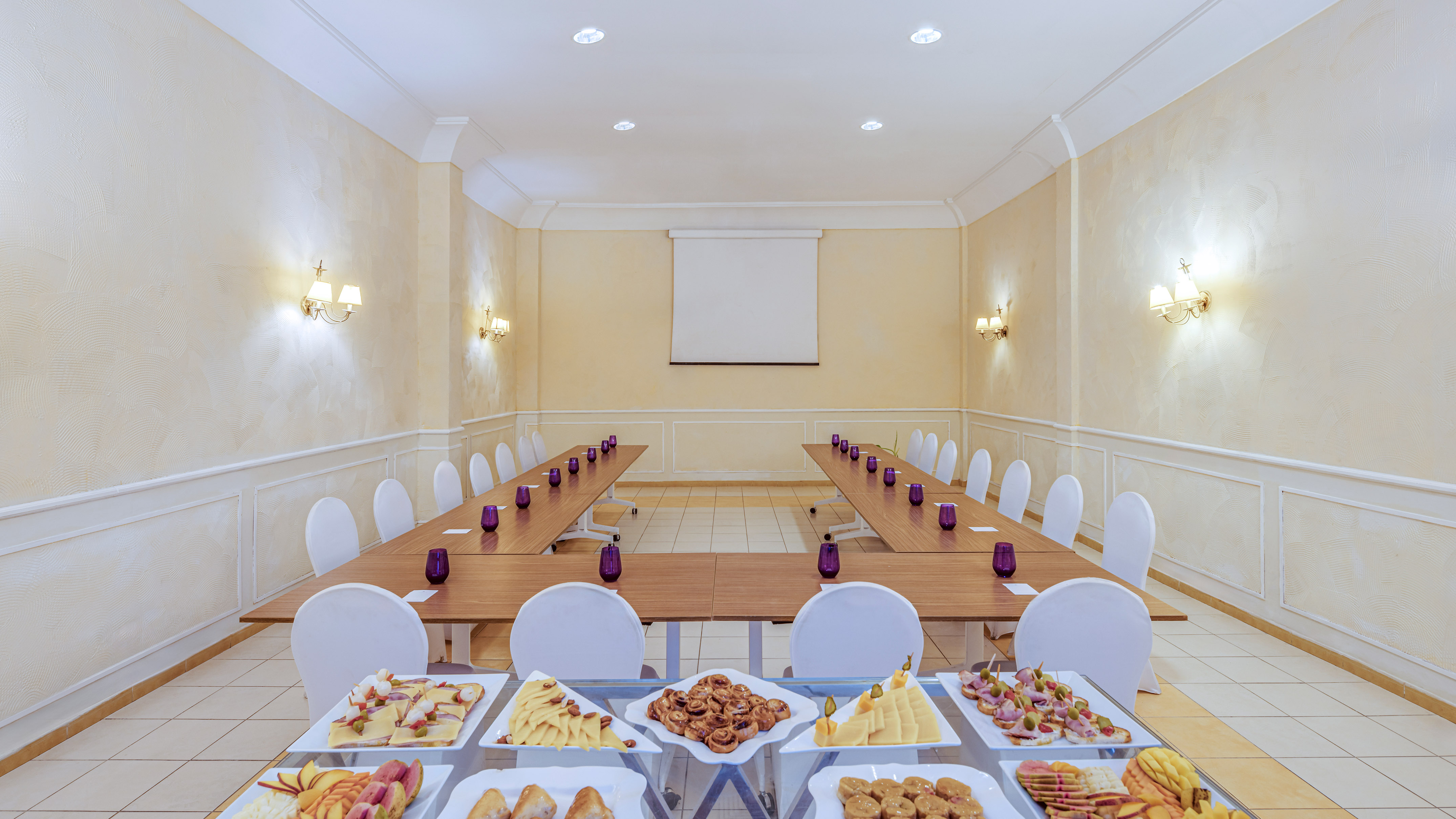 a room with a long table with food on it