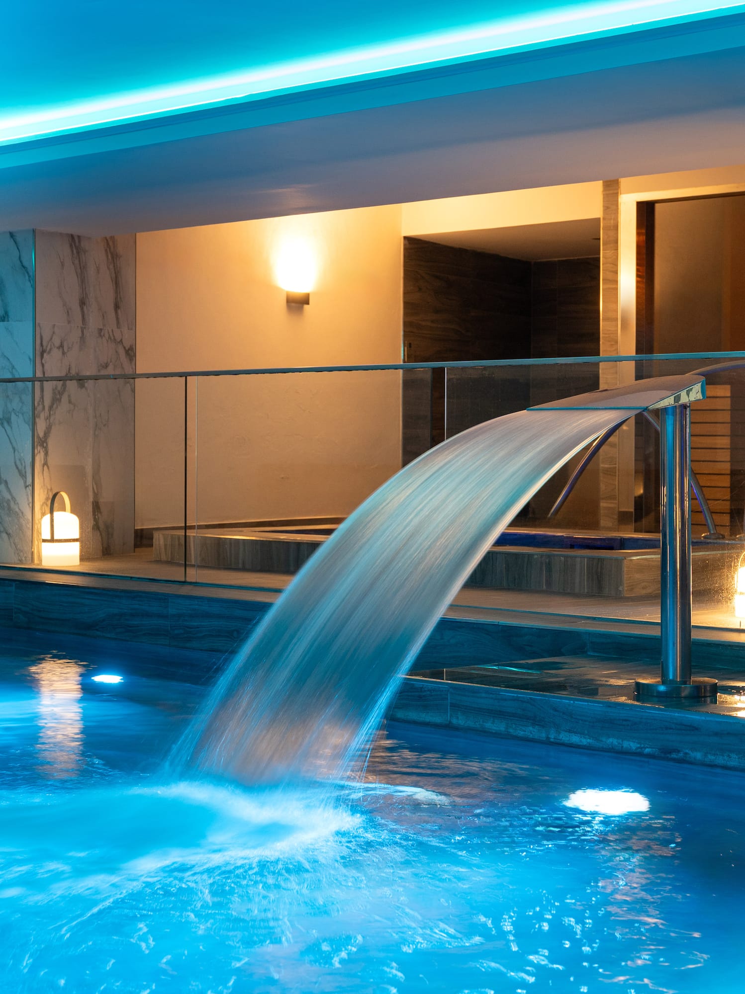 a pool with a waterfall