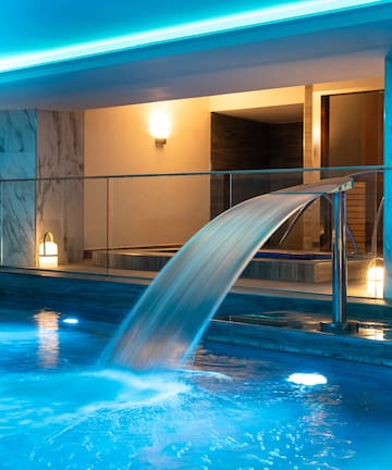 a pool with a waterfall