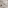 Modern white marble bathroom with vessel sink, sleek vanity, glass shower.