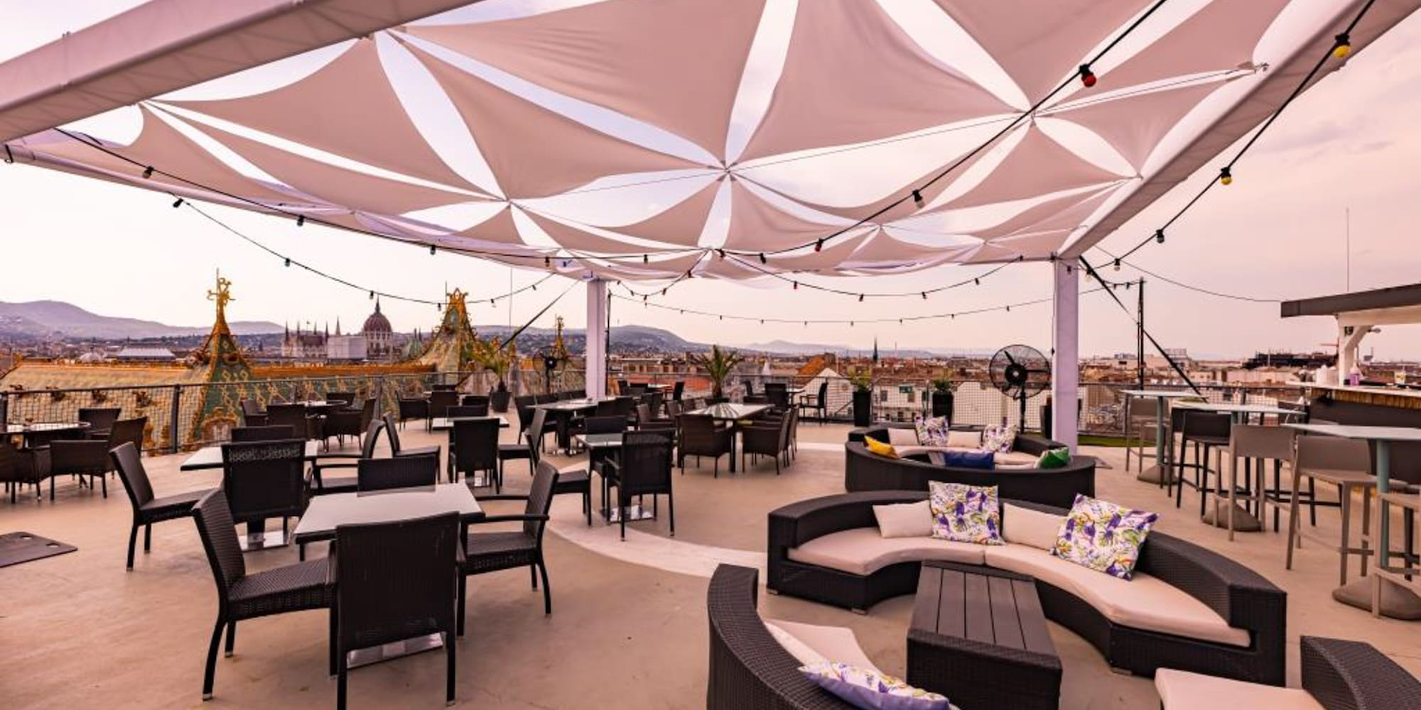 a patio with tables and chairs