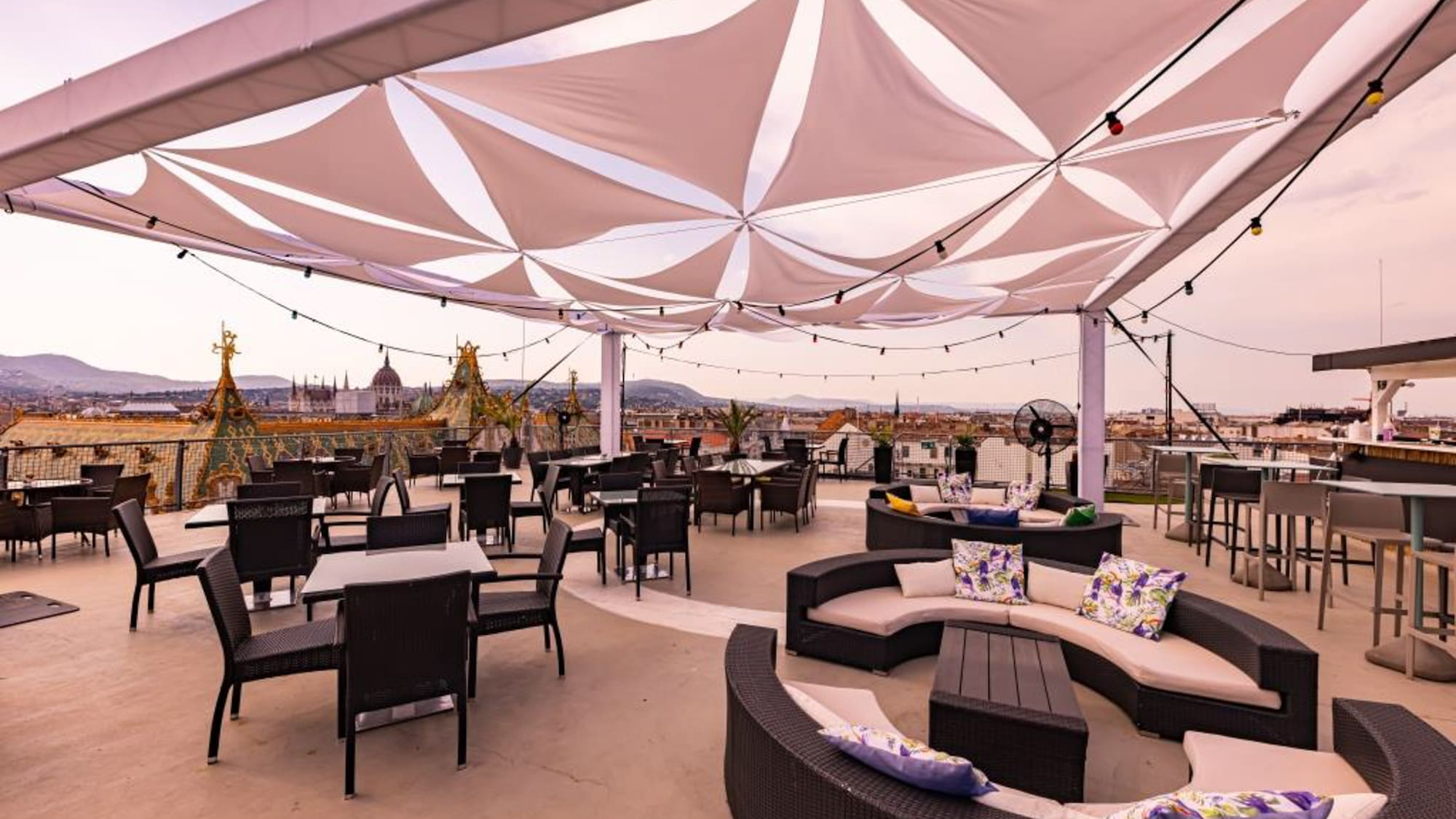 a patio with tables and chairs