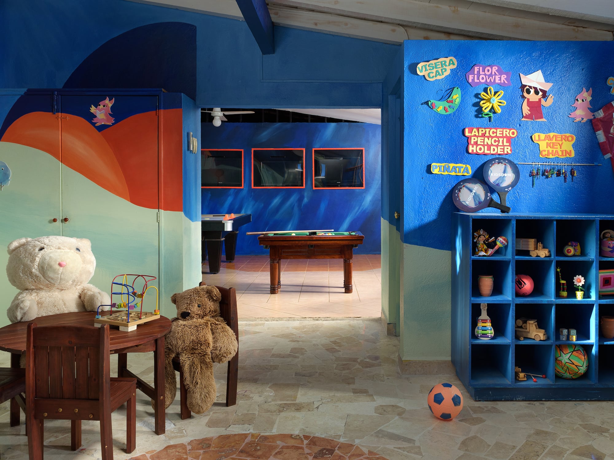 a room with a table and a table and a pool table