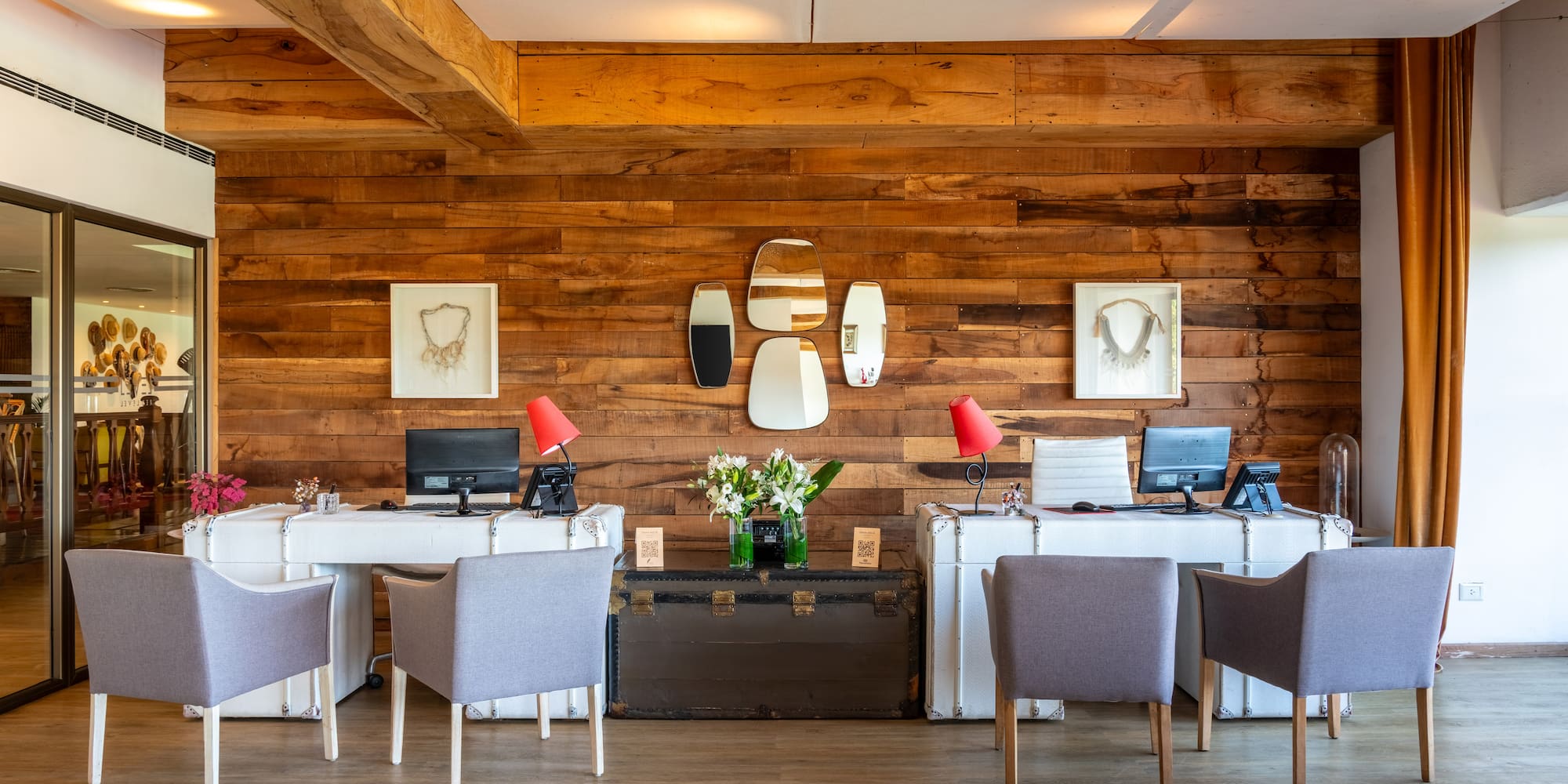 a room with a long couch and a buffet table