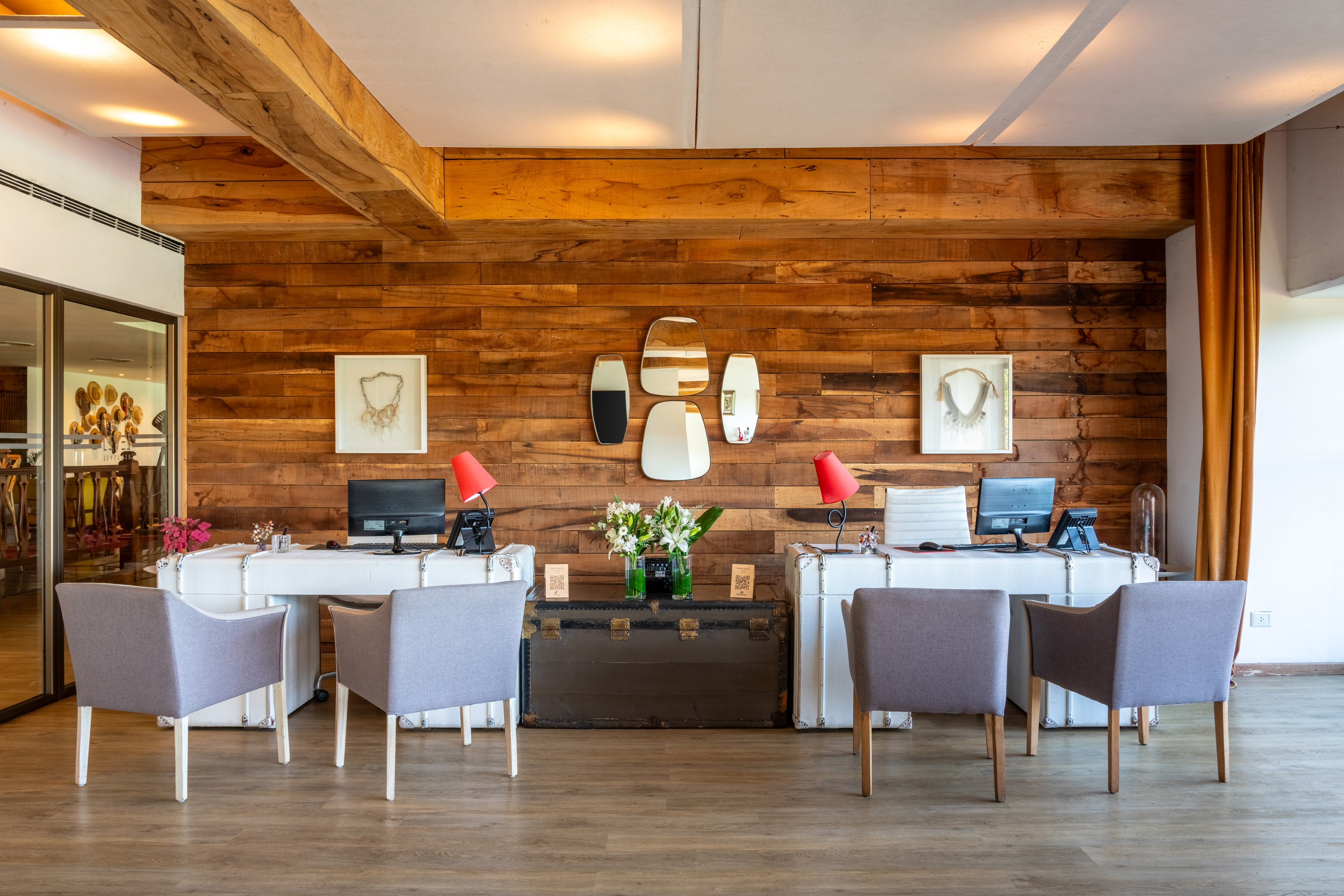 a room with a long couch and a buffet table