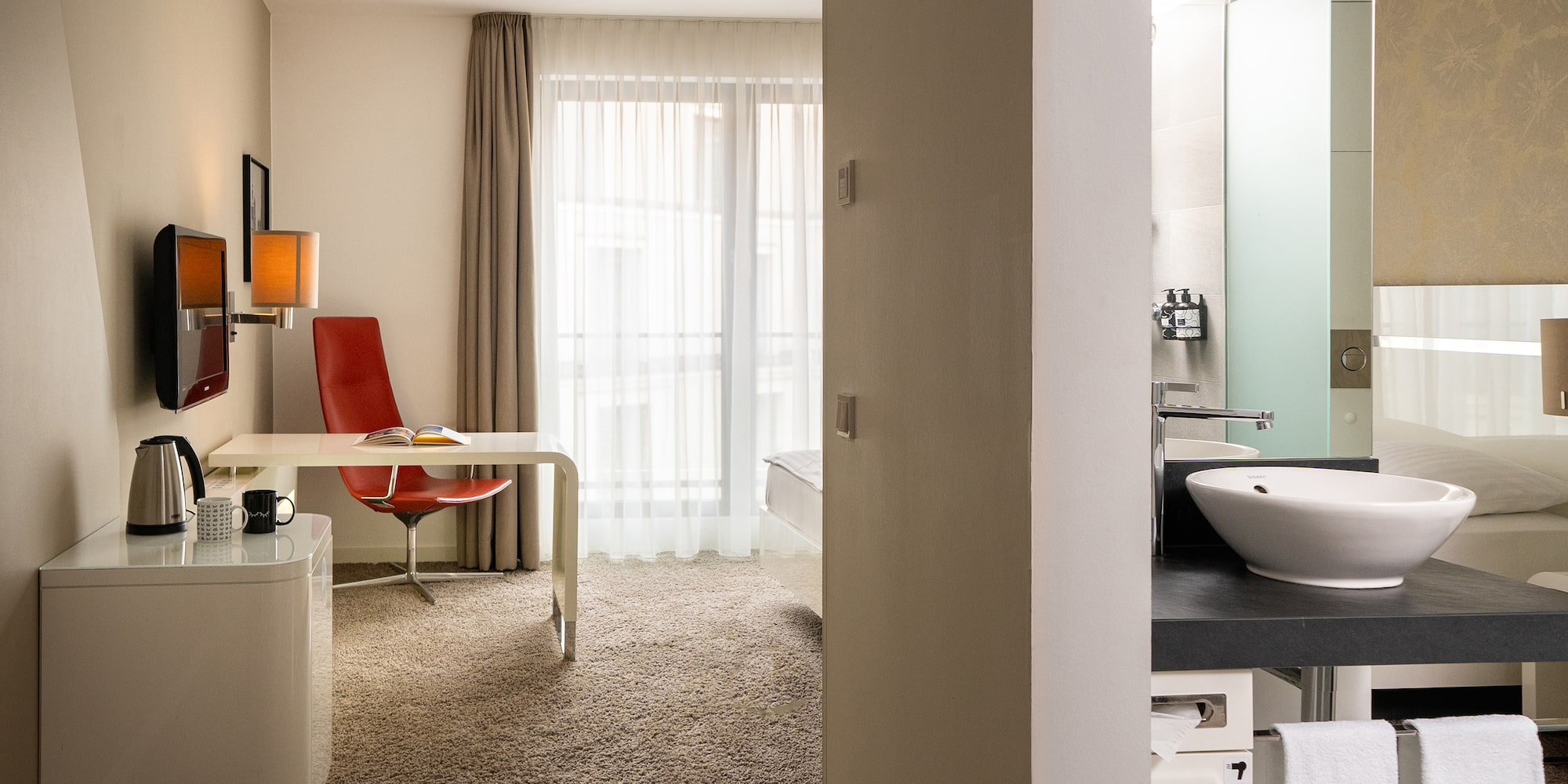 a room with a desk and a sink