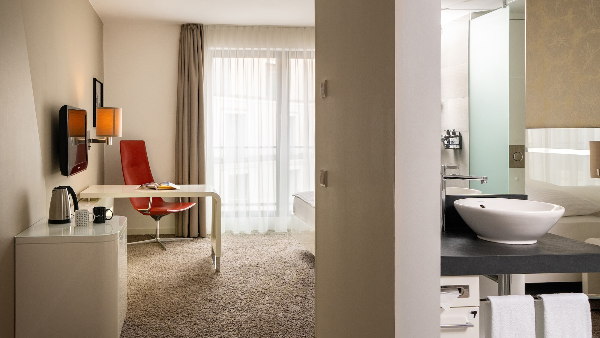 a room with a desk and a sink