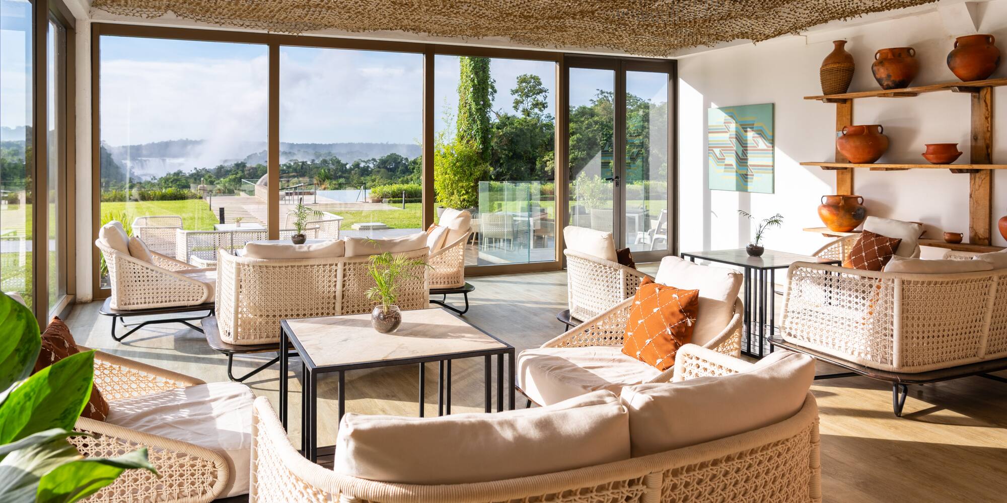 a room with wicker furniture and a large window