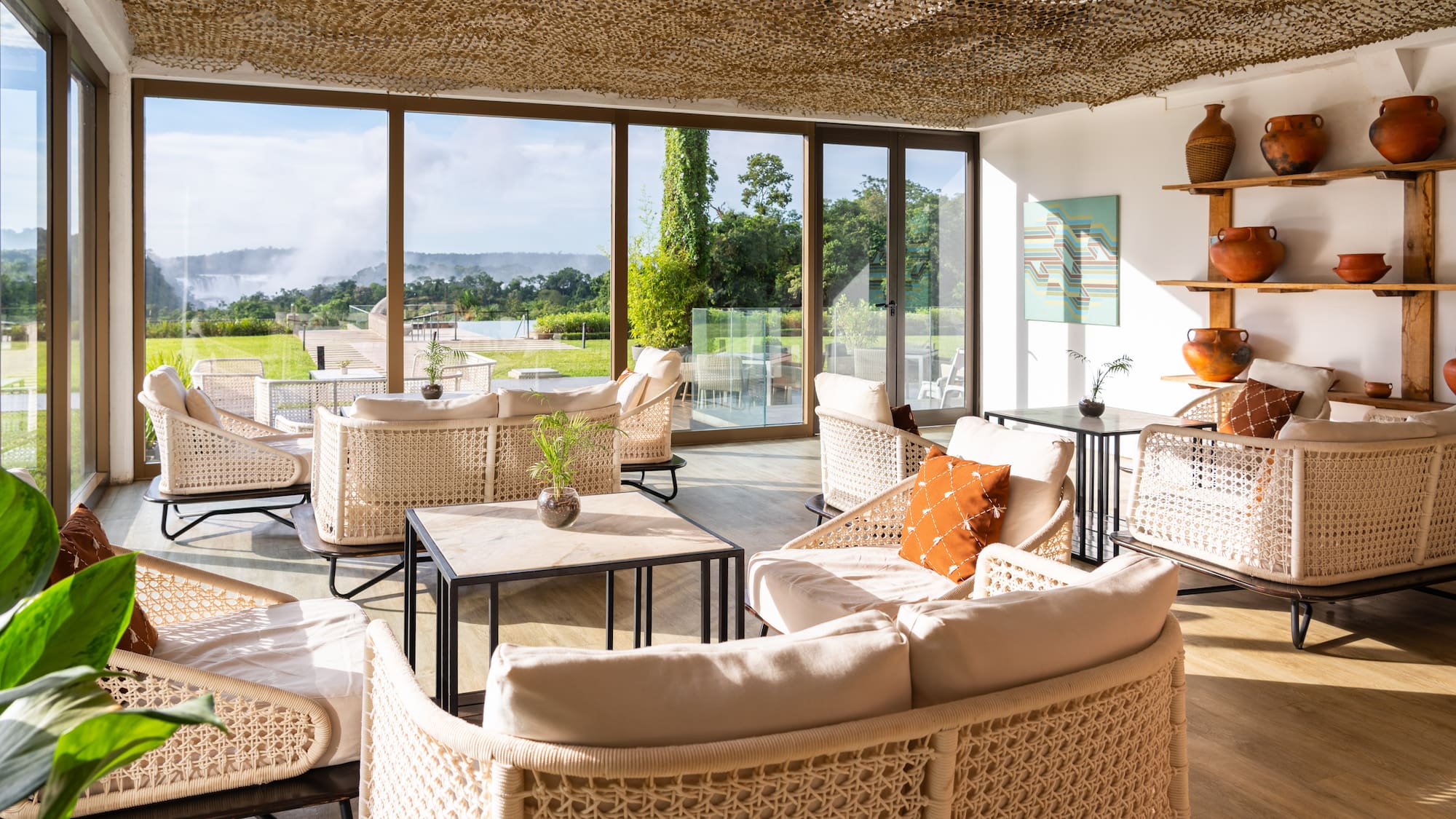 a room with wicker furniture and a large window