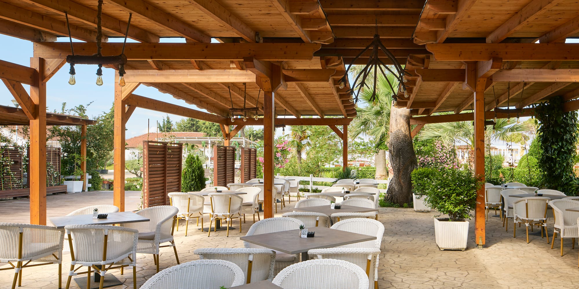 a patio with tables and chairs