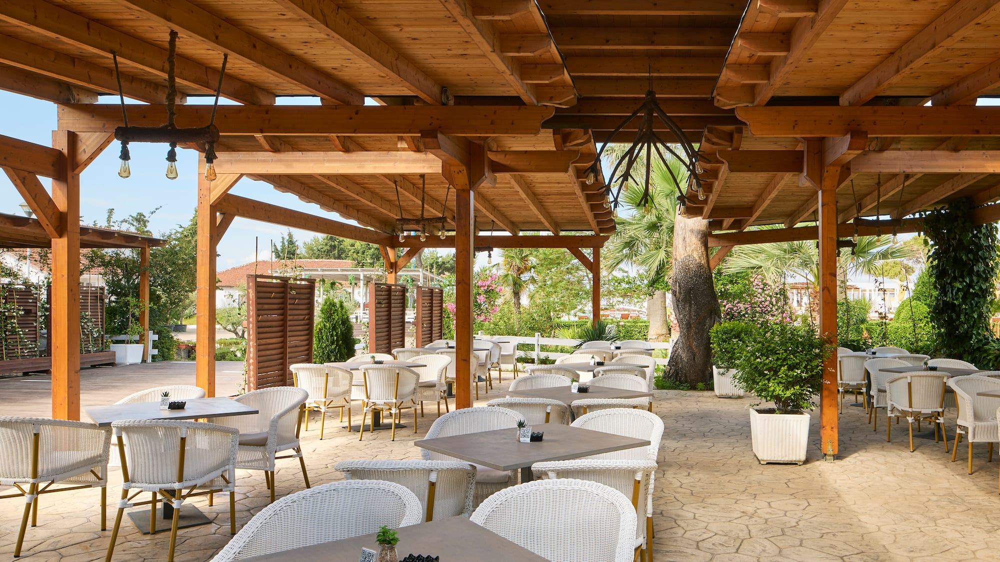 a patio with tables and chairs