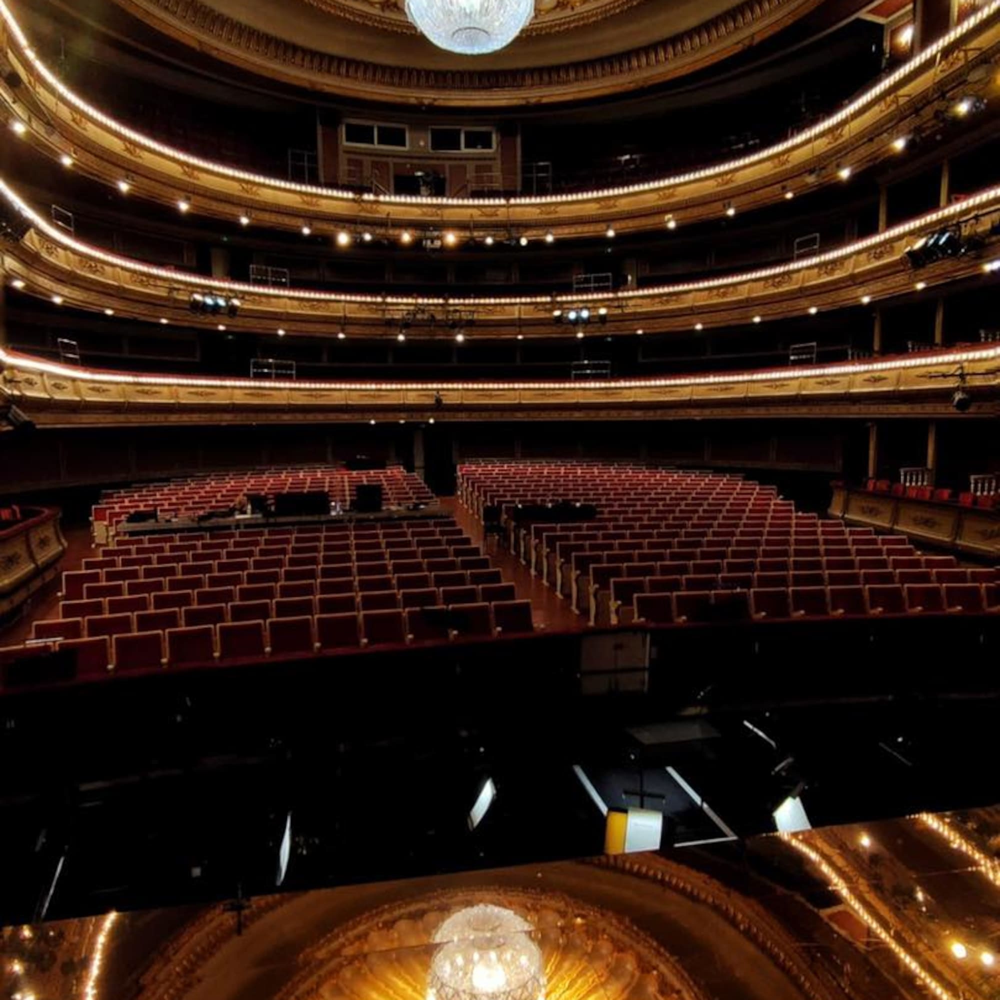 a large theater with a chandelier