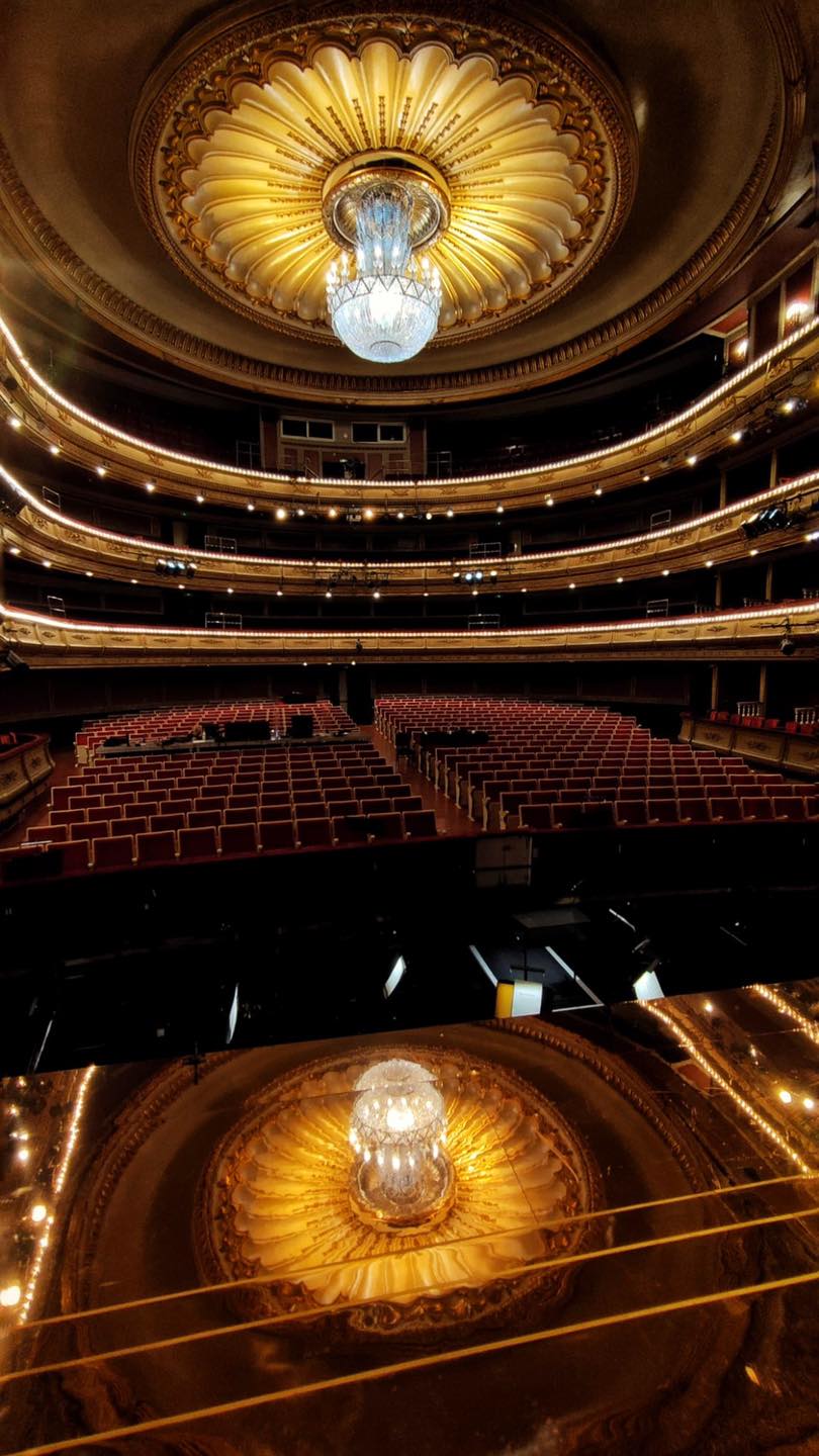 a large theater with a chandelier