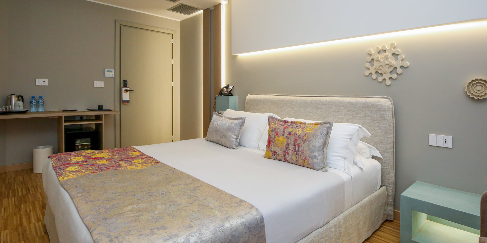 a bed with pillows in a room