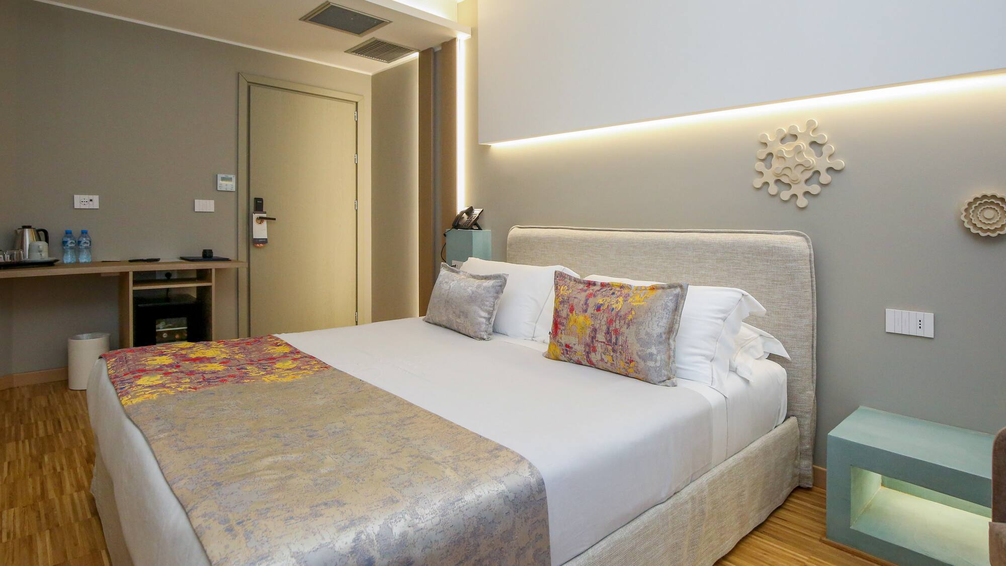 a bed with pillows in a room