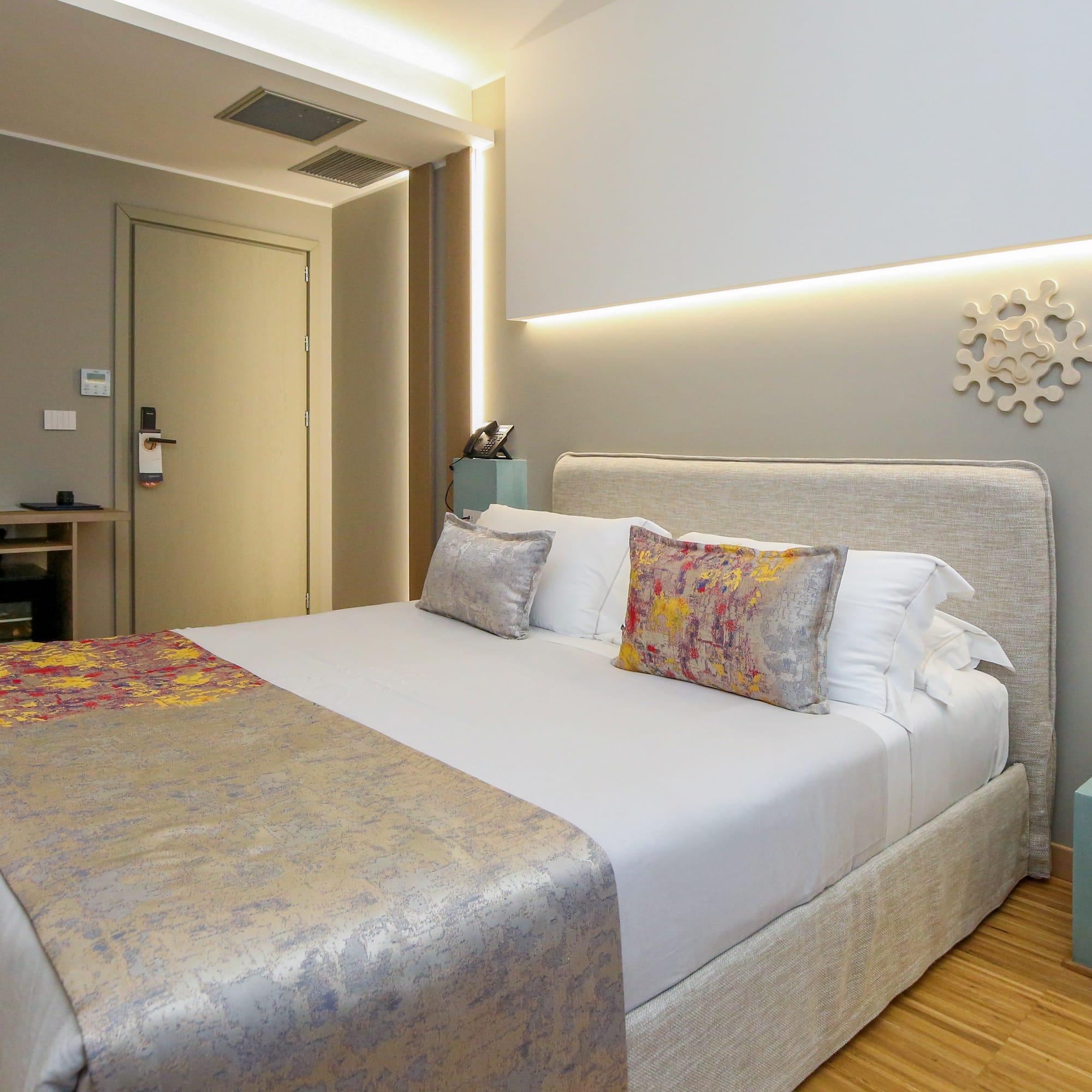 a bed with pillows in a room