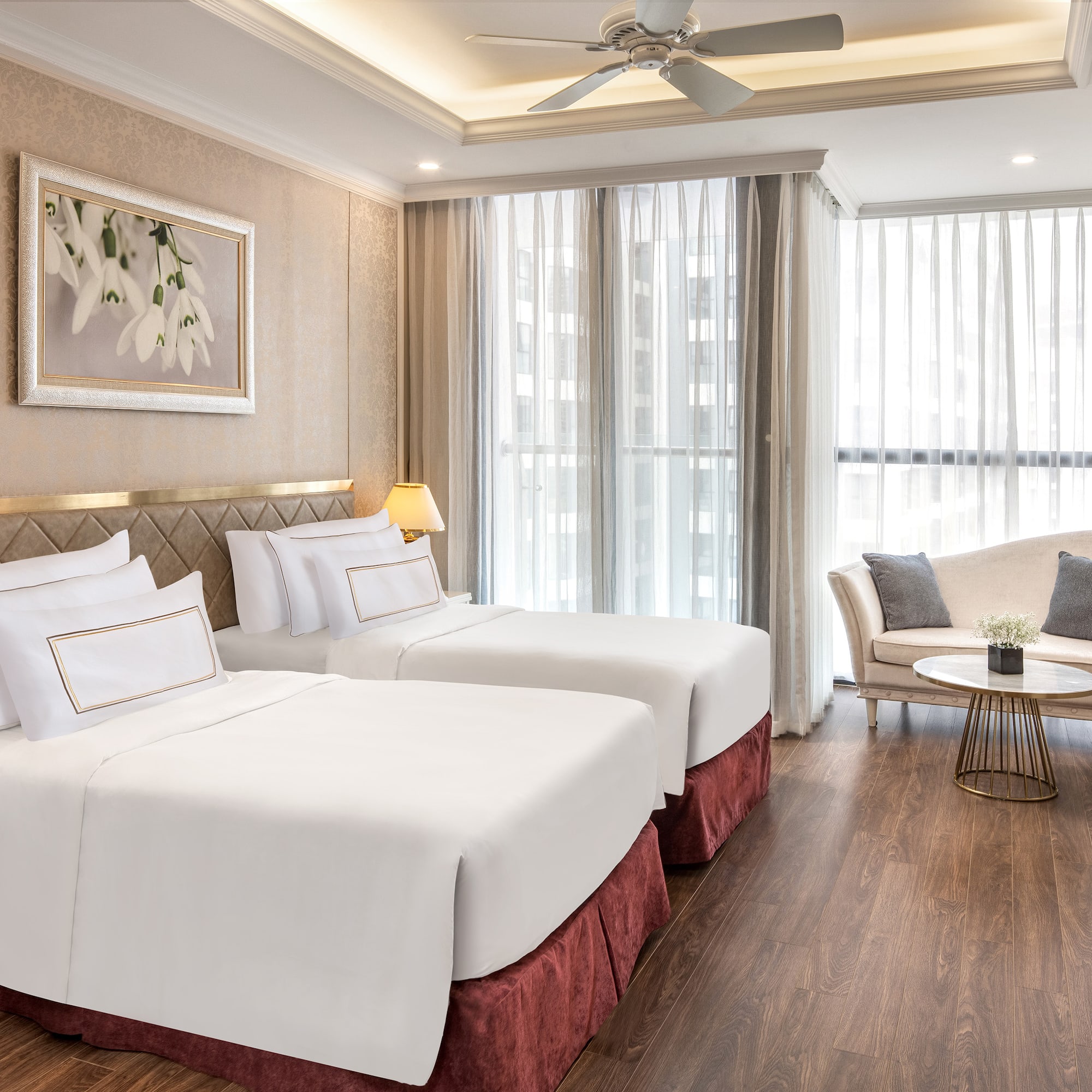 a room with two beds and a couch