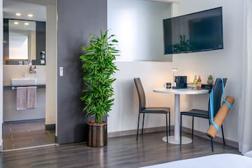 a room with a table and a tv