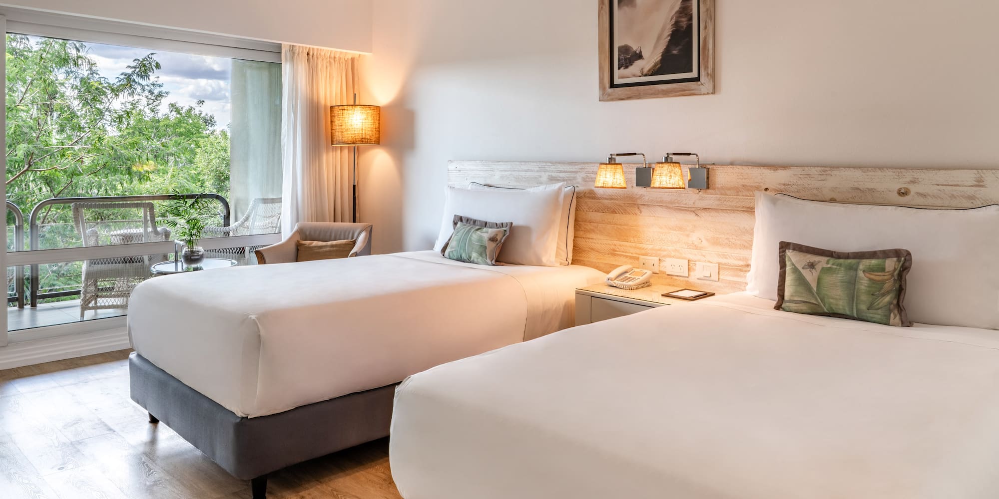 a room with two beds and a table