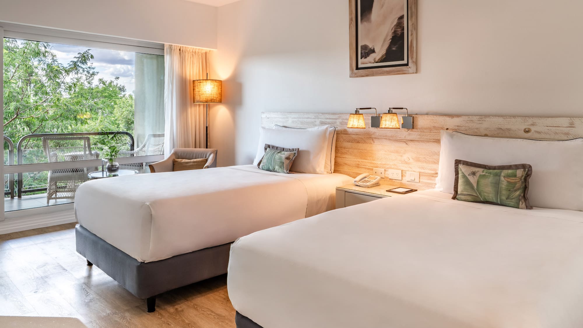 a room with two beds and a table