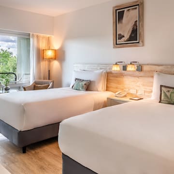 a room with two beds and a table