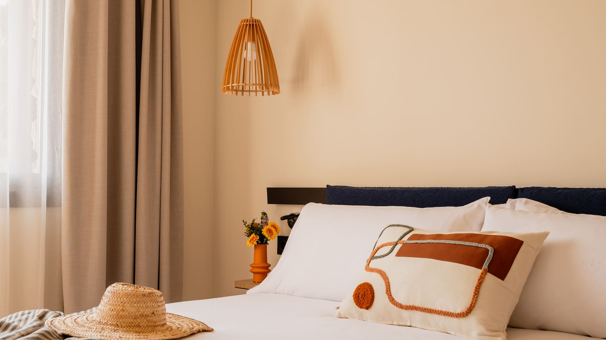 a bed with a hat and pillow