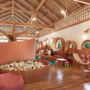 a room with a play area and a ball pit