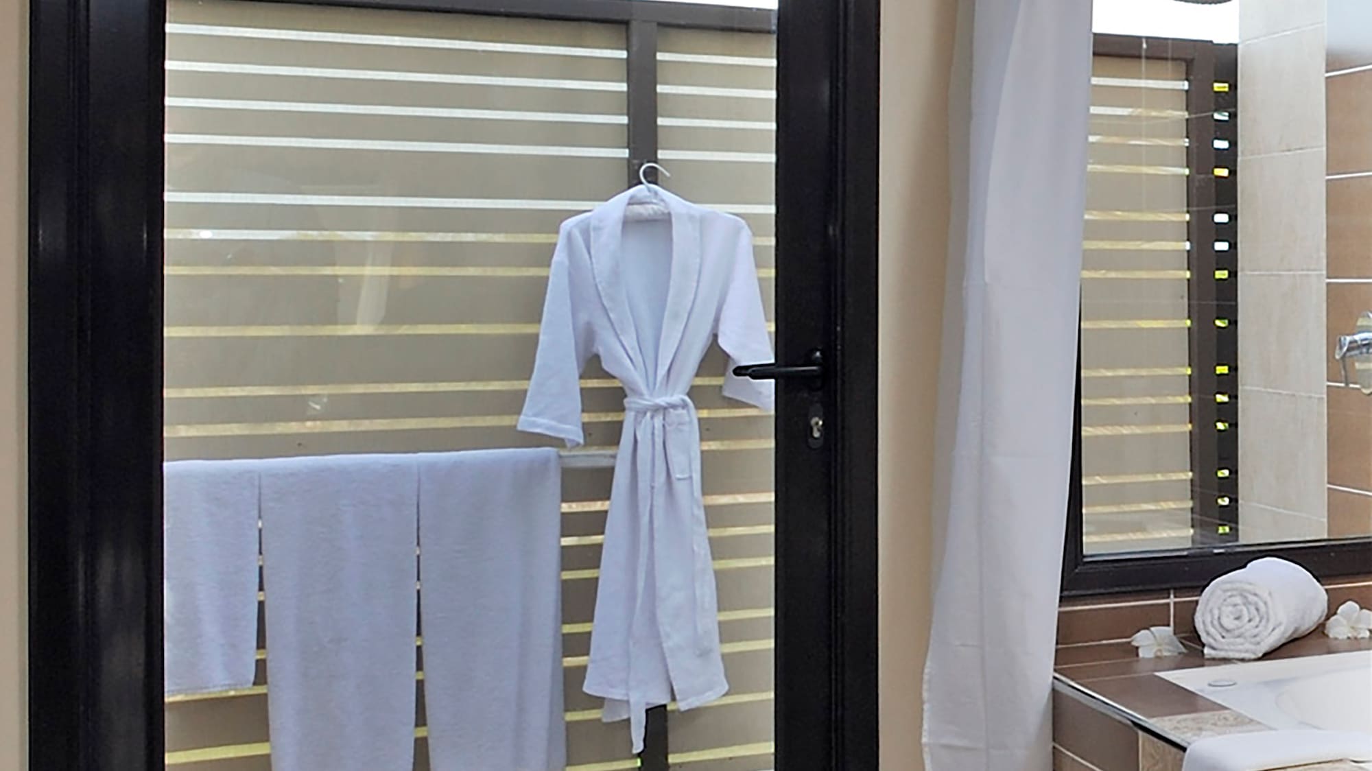 a door with a white robe on it