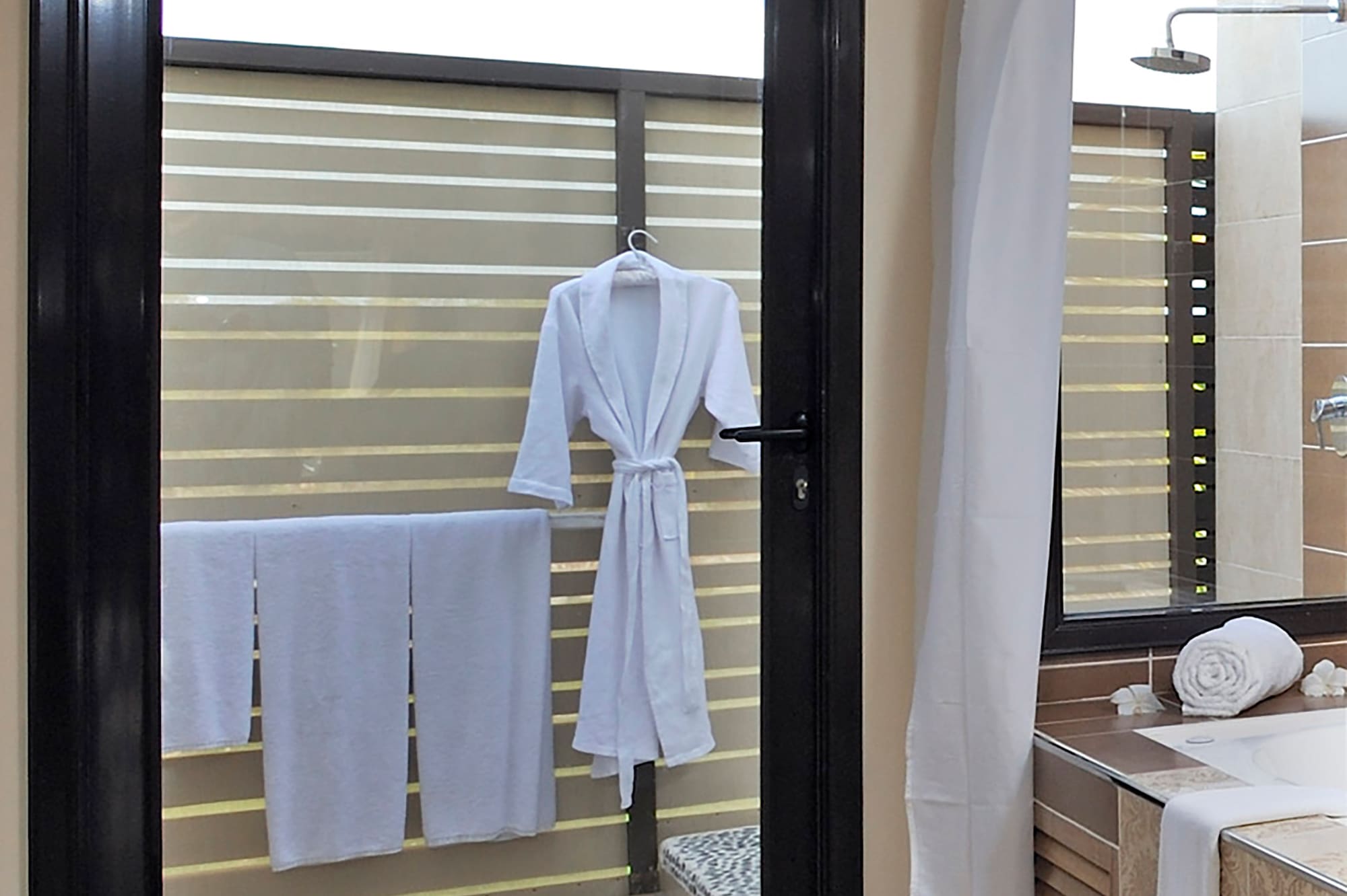 a door with a white robe on it