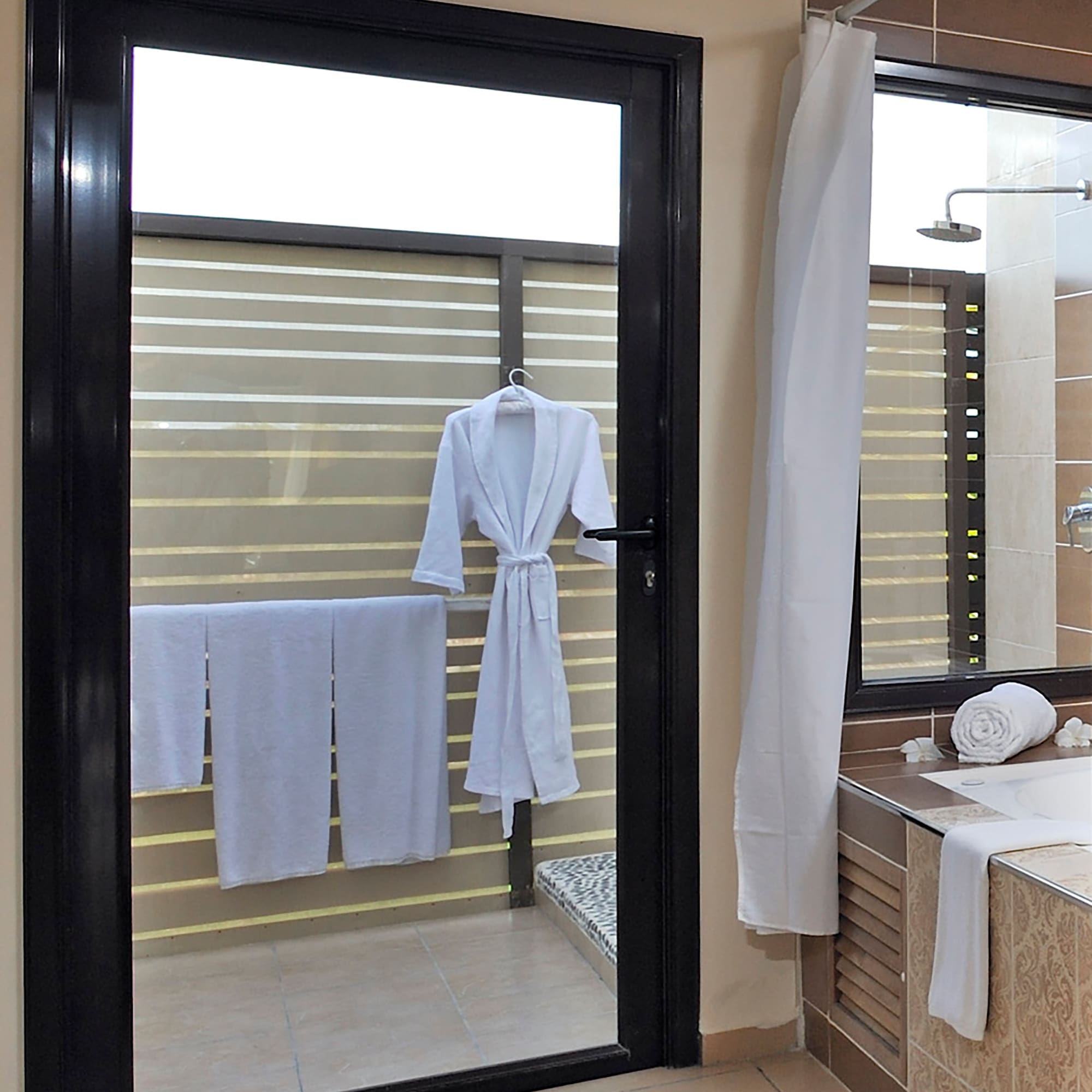 a door with a white robe on it