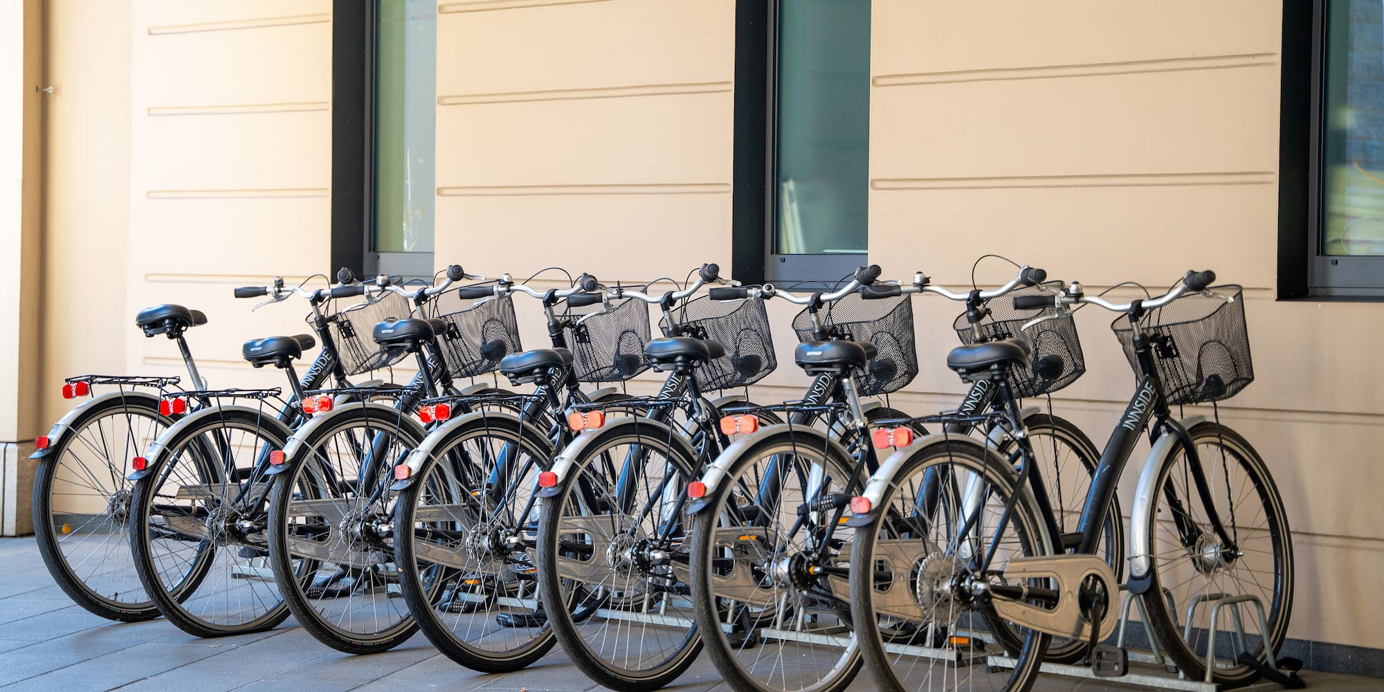 a row of bicycles parked in front of a building