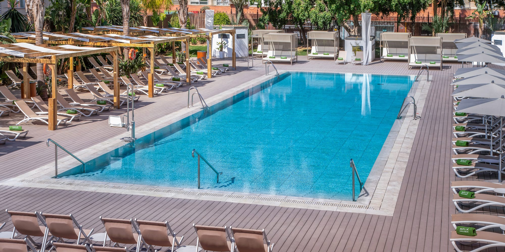 a pool with chairs and a deck