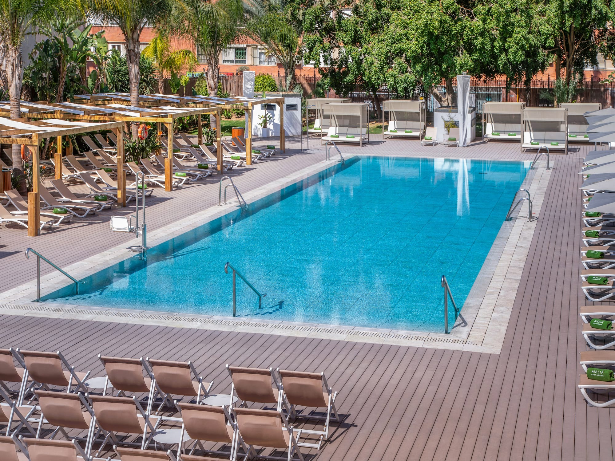 a pool with chairs and a deck