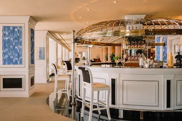a bar with a bar and chairs