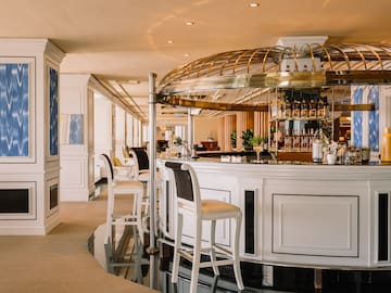 a bar with a bar and chairs