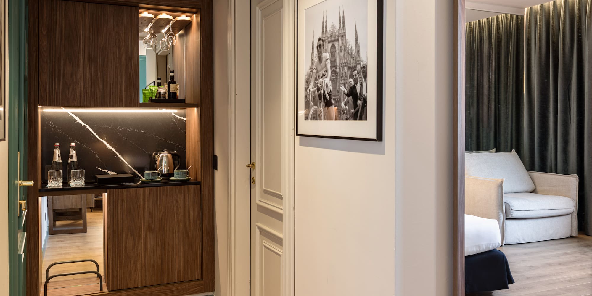 a room with a mirror and a picture on the wall