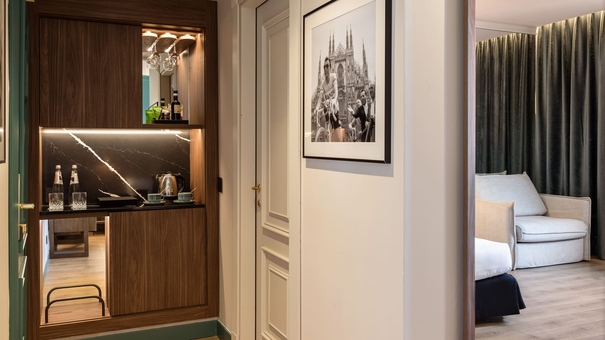 a room with a mirror and a picture on the wall