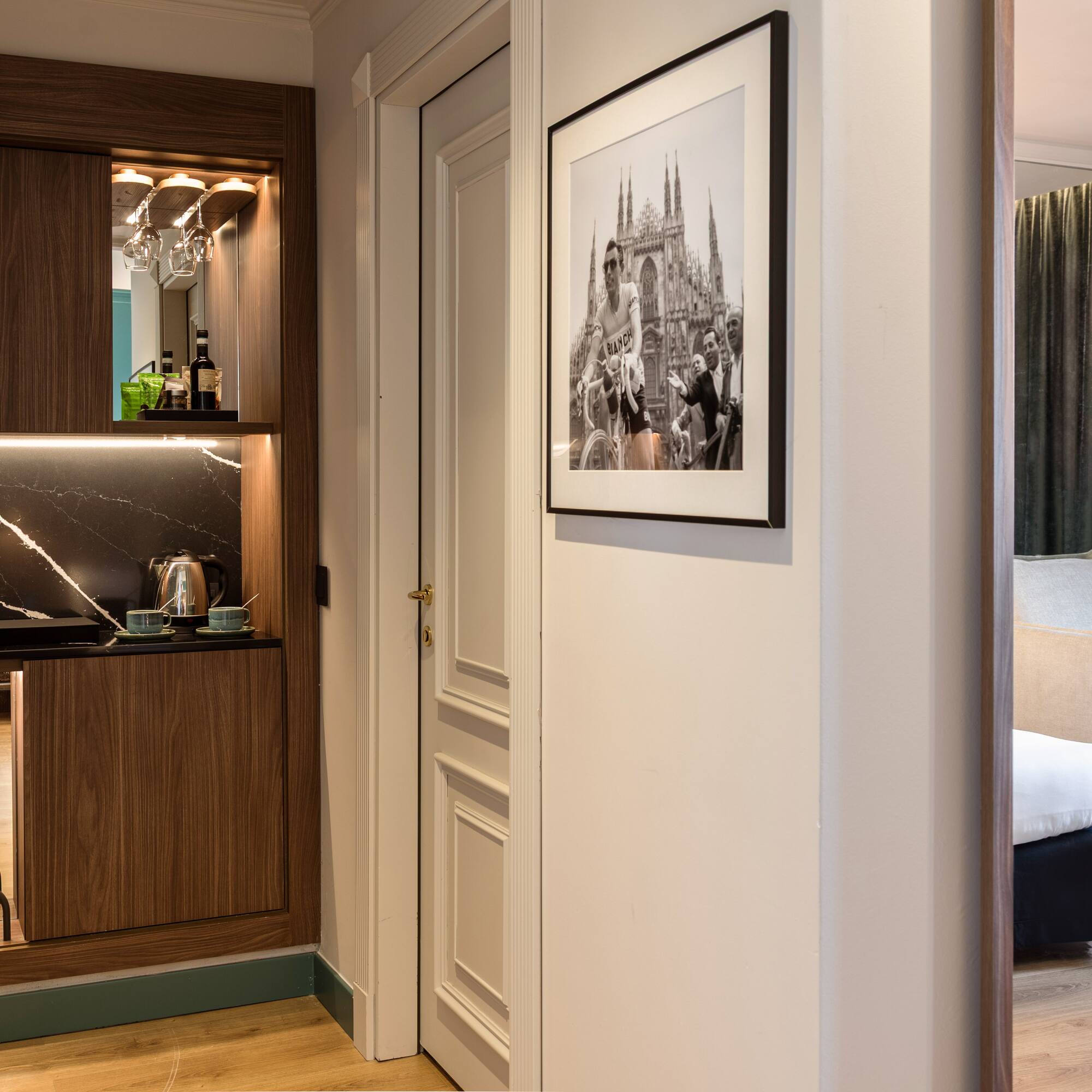 a room with a mirror and a picture on the wall