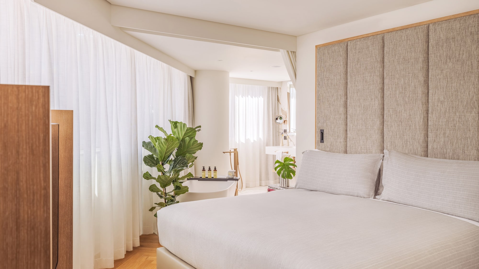 a bedroom with a bed and a sink