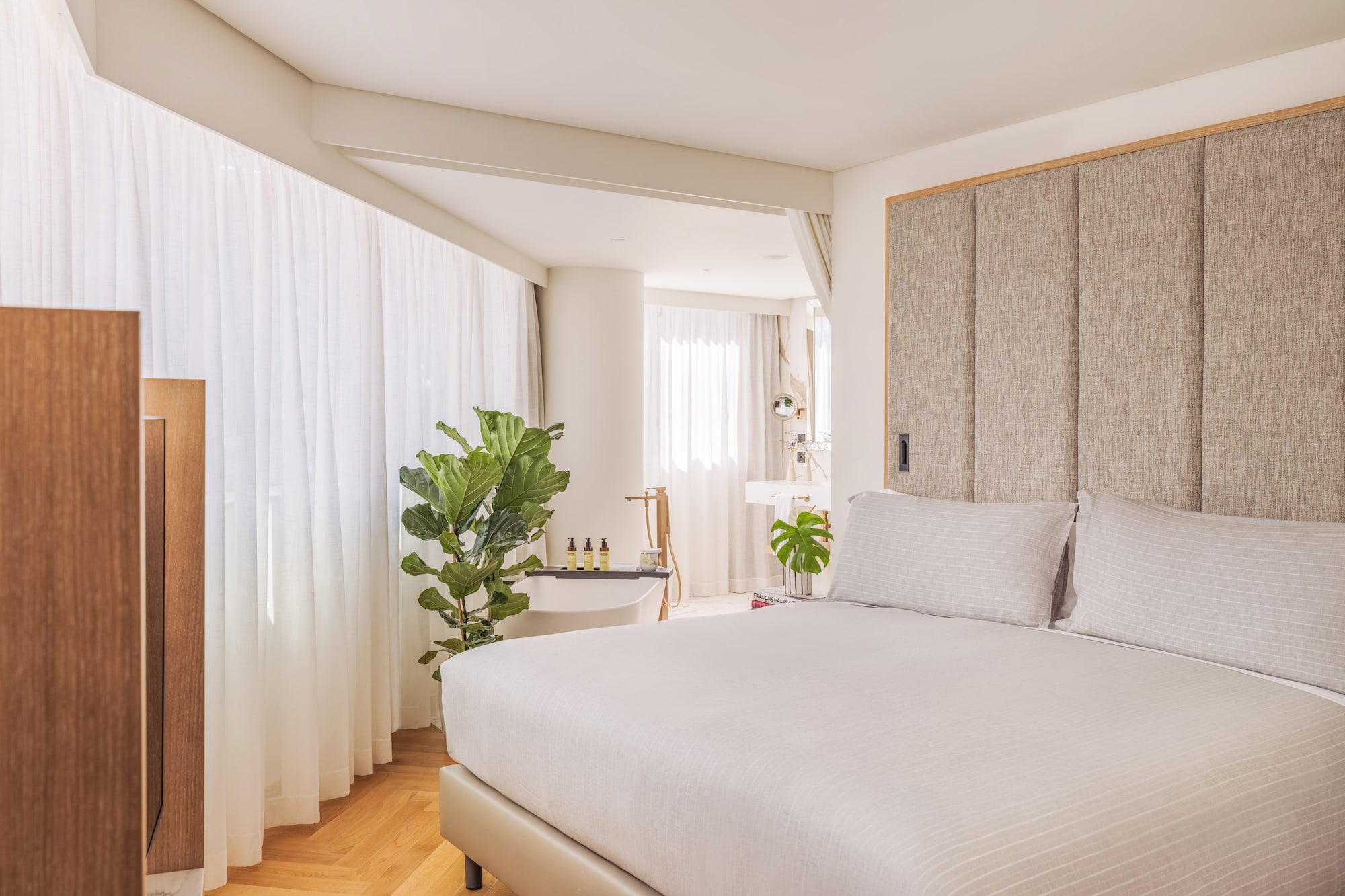 a bedroom with a bed and a sink