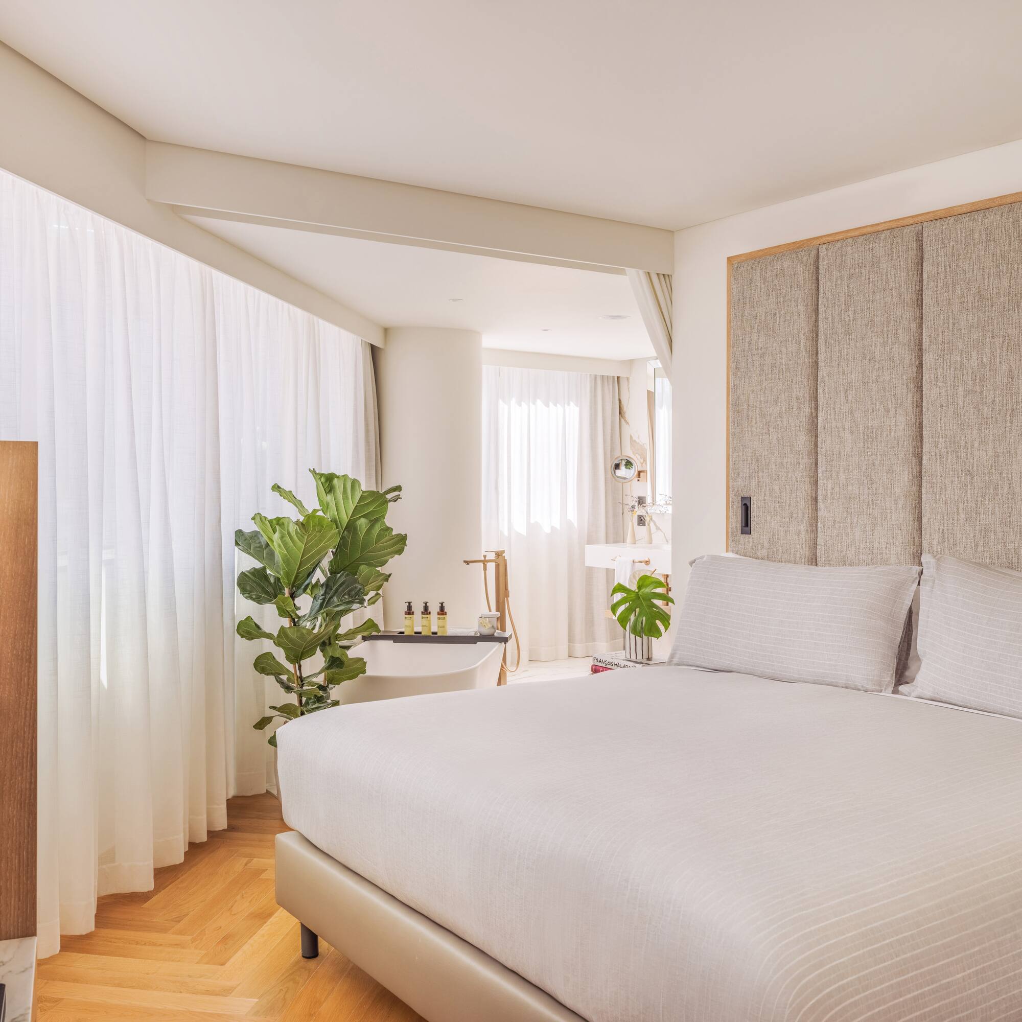 a bedroom with a bed and a sink