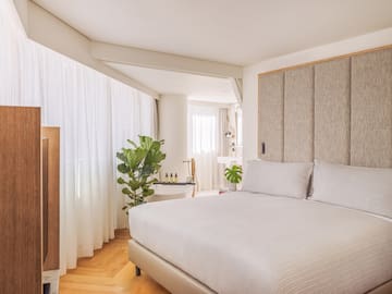 a bedroom with a bed and a sink