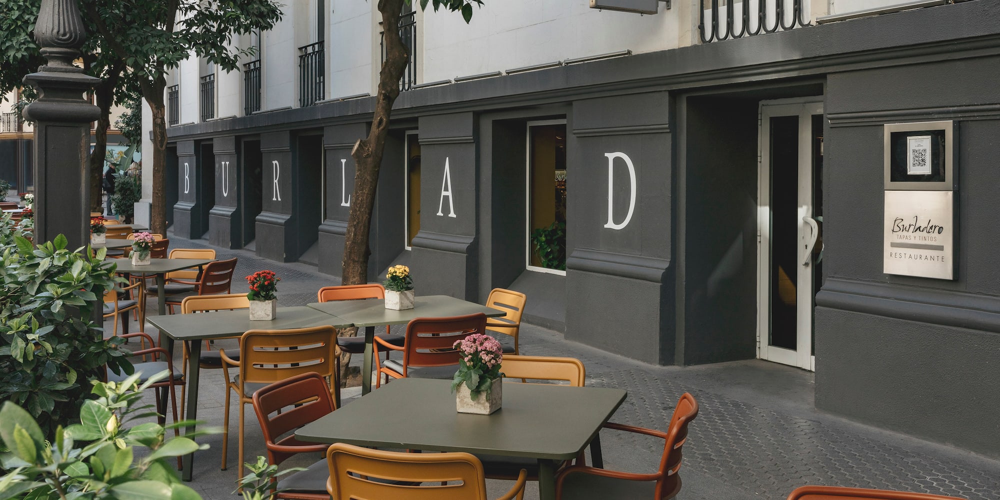 tables and chairs outside a building