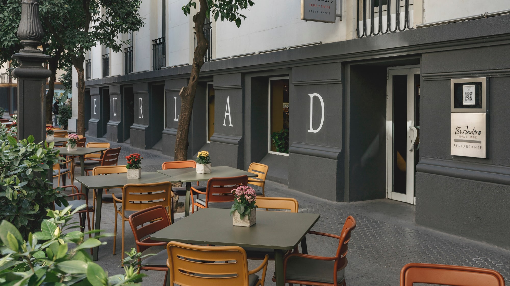 tables and chairs outside a building