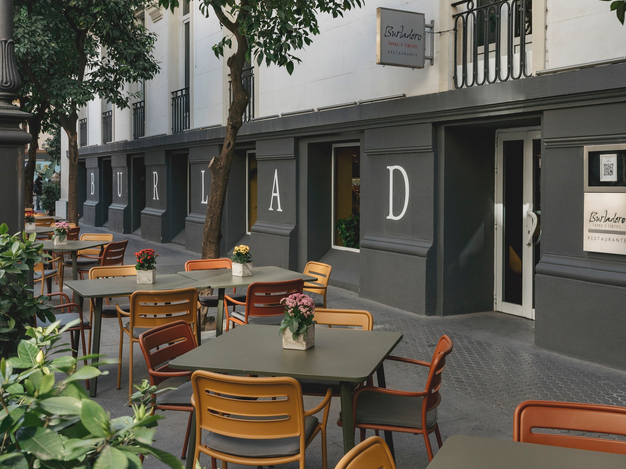 tables and chairs outside a building