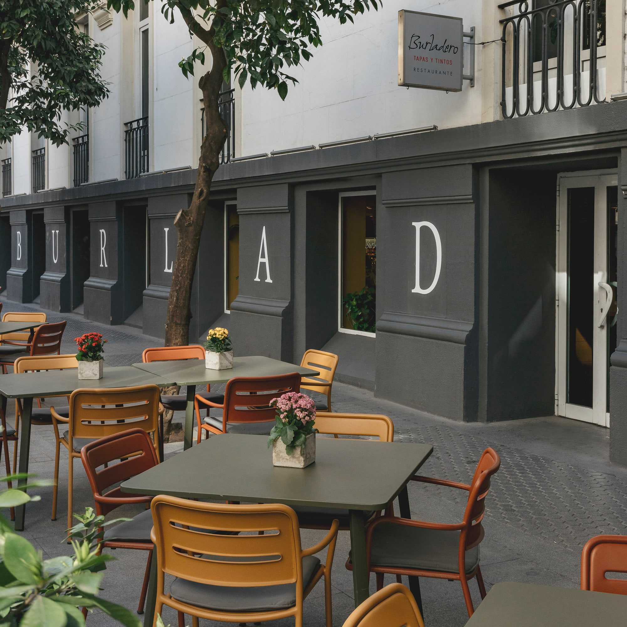 tables and chairs outside a building