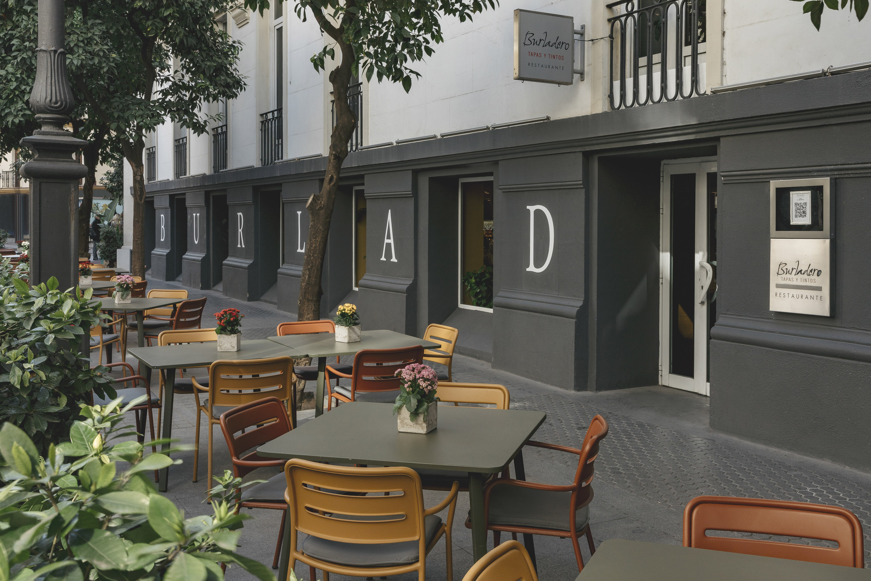 tables and chairs outside a building