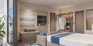 a bedroom with a bed and a wardrobe