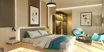 a bedroom with a bed and a chair