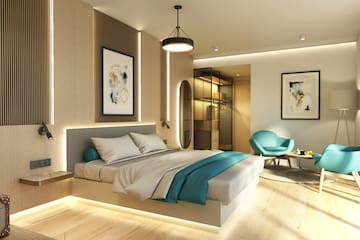 a bedroom with a bed and a chair